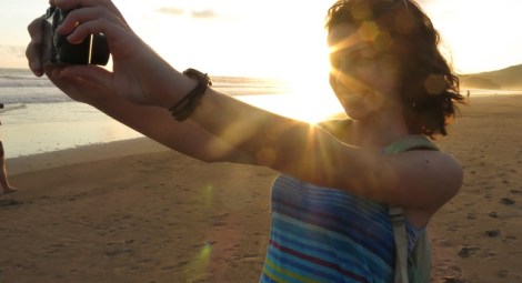 a-solo-traveler-take-a-photo-of-herself-on-the-beach-872013-155937_panoramic